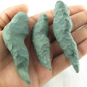 Fossilized Cobra Snakes in hand